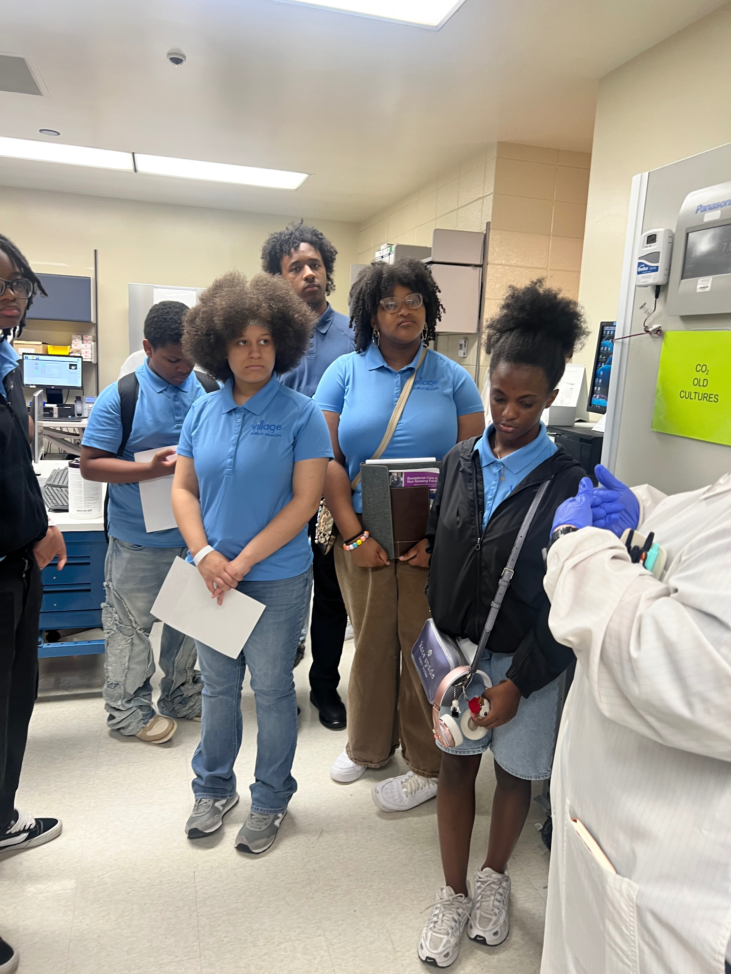 Students touring a hospital laboratory during a site visit