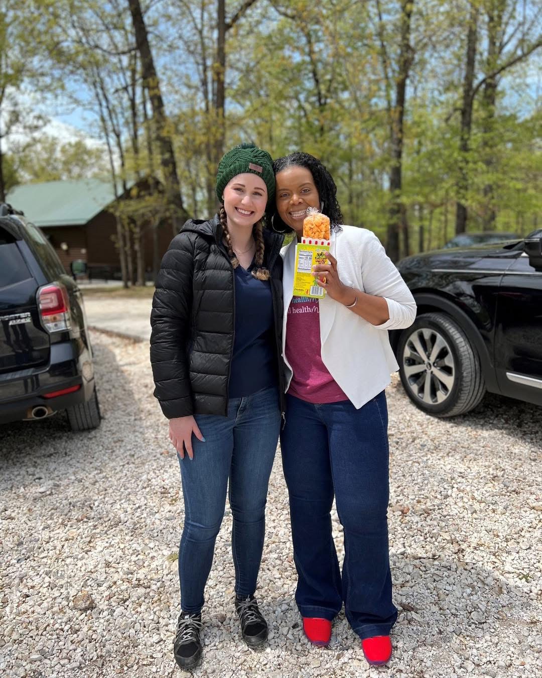 Dr. Mumford with a colleague at an outdoor retreat