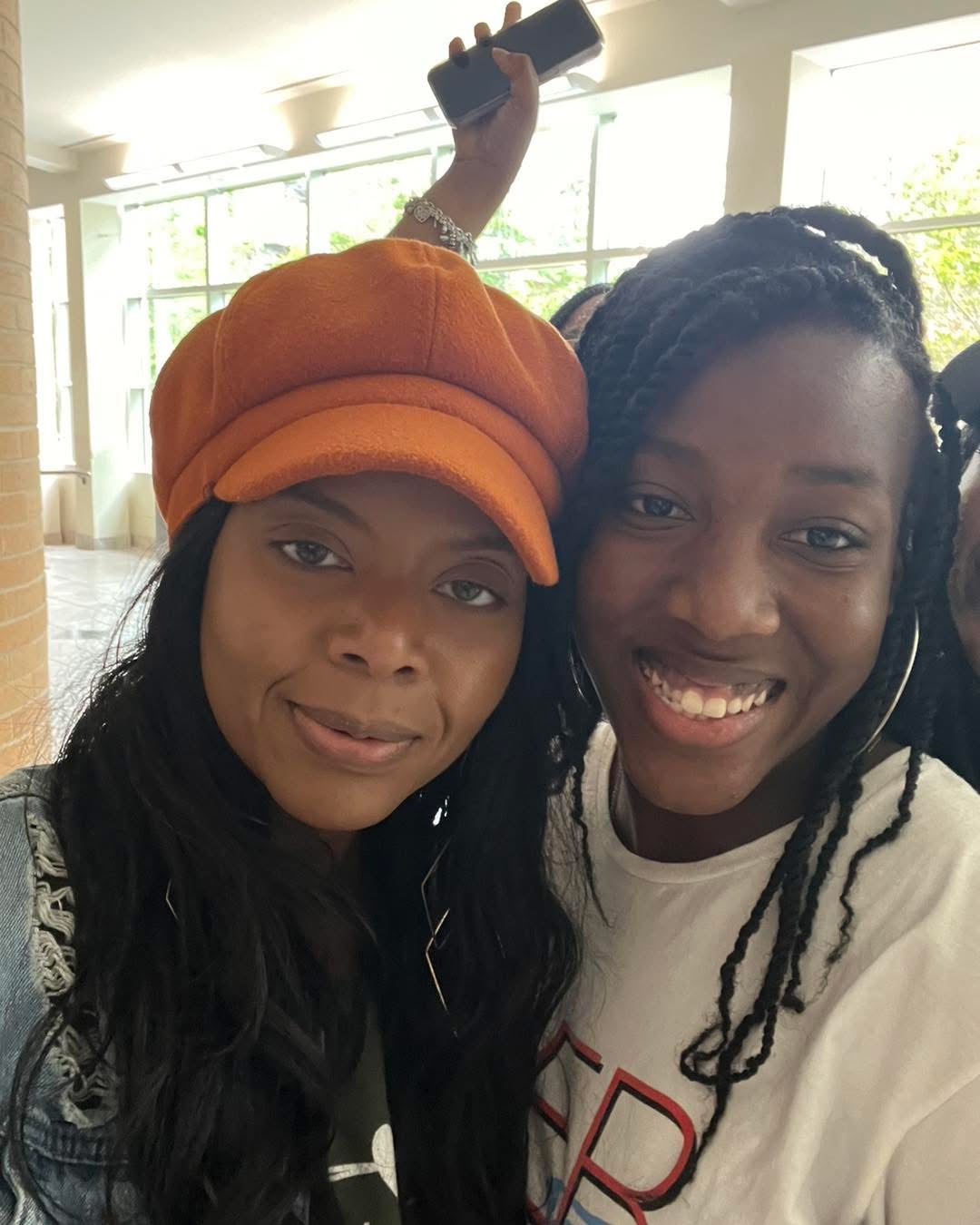 Dr. Mumford with a student at an outreach event