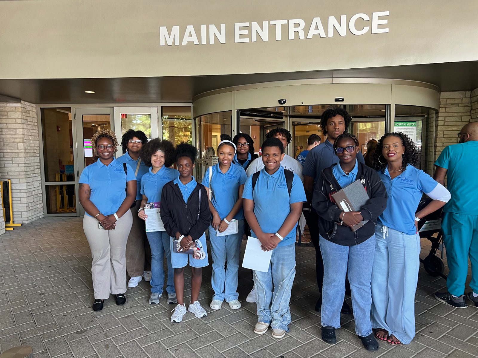 The 2026 Summer Institute cohort outside a hospital main entrance
