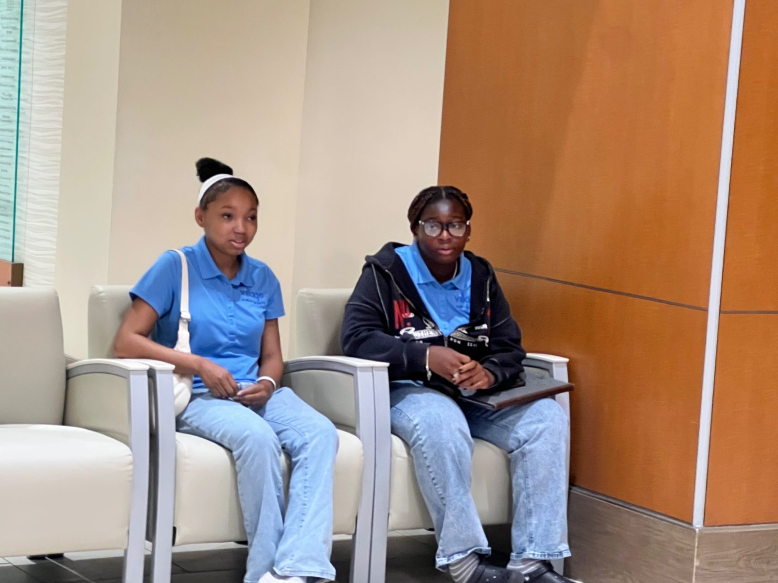 Two Summer Institute students listening during a program session
